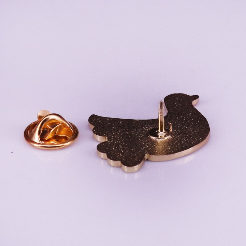 back of enamel dove pin in gold