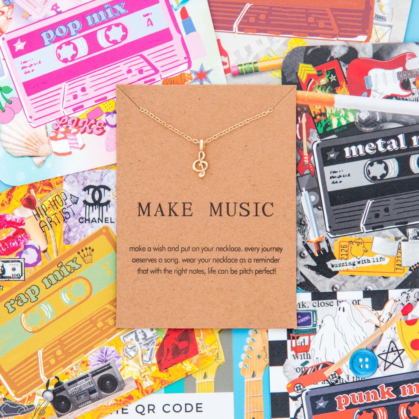Bring music into your life with this unique music note necklace and matching paper coasters featuring different genres like rap and punk rock. The necklace is accompanied by a boom box pin, concert greeting card, quirky guitar earrings, Billie Eilish page flags, and a pop-up book on music history. Get ready to rock and roll and jazz up your home with these eclectic music-themed items.