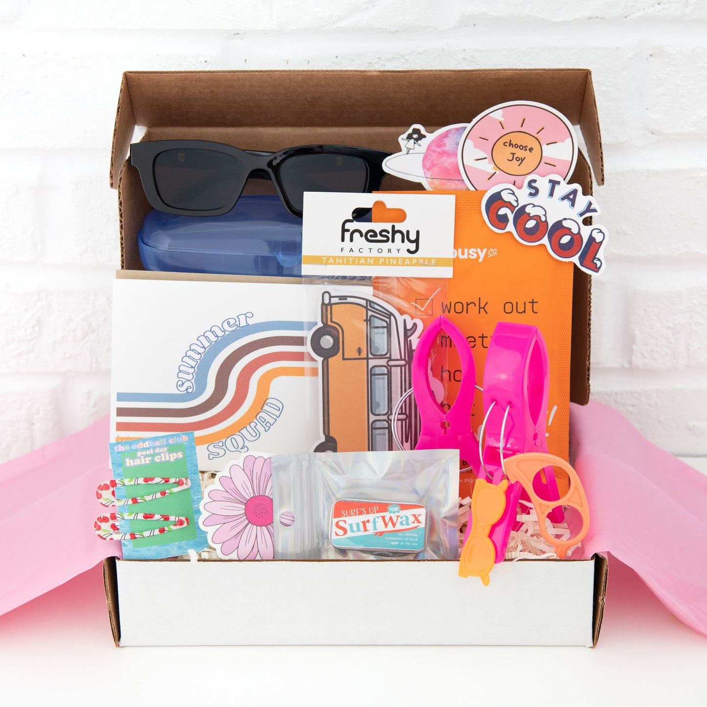 Get ready for summer with our subscription box! Includes sunglasses in a case, surf wax tin of chapstick, summer greeting card, and surf van air freshener. Perfect for beach lovers and surfers. Shop now on Ratbone Skinny and enjoy the sun in style!